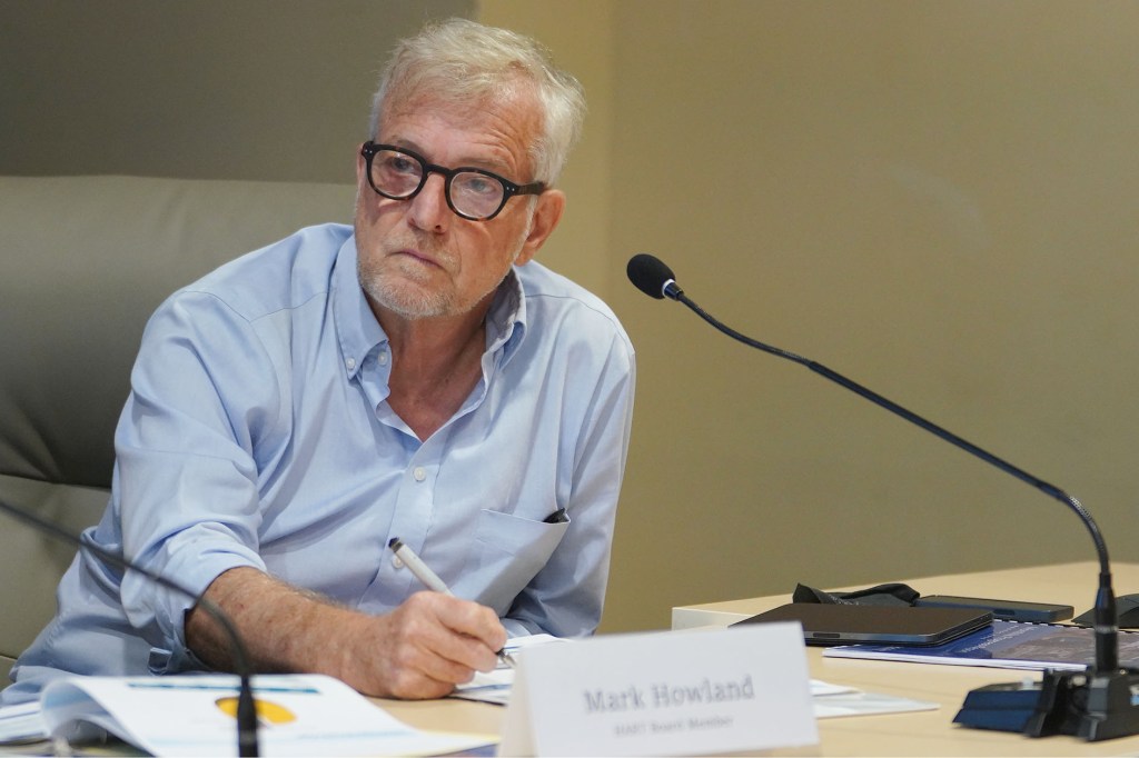 HART Board Member Anthony Aalto listens to colleagues during a board meeting held at Alii Place.