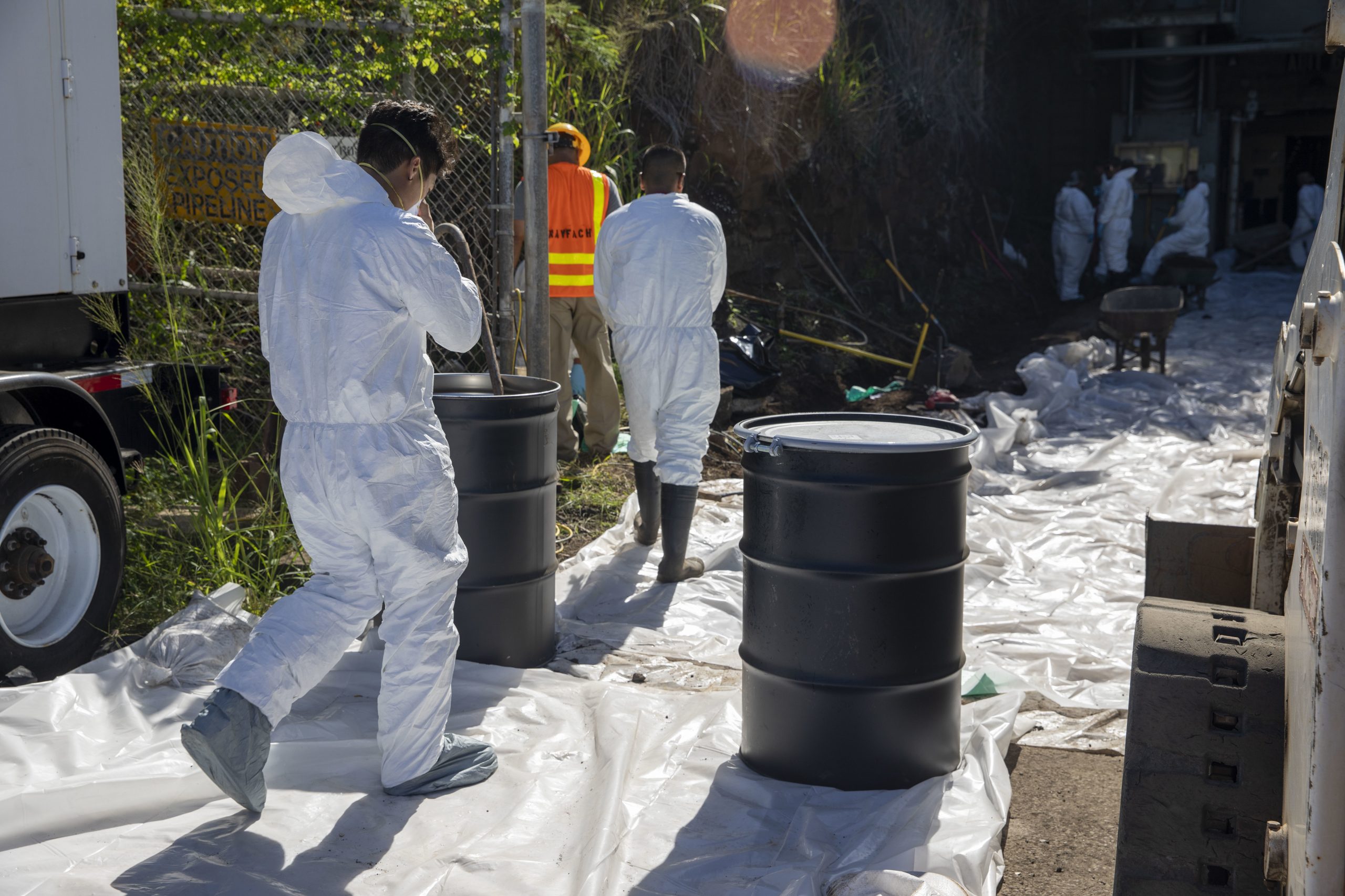 Naval Facilities Engineering Systems Command (NAVFAC) Fleet Logistics Center (FLC) Pearl Harbor employees work on excavating and removing contaminated soil from the spill site as part of NAVFAC Public Works Department and Joint Task Force-Red Hill’s (JTF-RH) hazard material spill recovery operation at the Red Hill Bulk Fuel Storage Facility (RHBFSF) in Halawa, Hawaii, Dec. 1, 2022. Remediation of the spill site through excavation and removal of contaminated surfaces and material was immediately initiated after an estimated 1,100 gallons of aqueous film forming foam (AFFF) concentrate spilled from the fire suppression system at RHBFSF Adit 6 on Nov. 29, 2022. JTF-RH was established by the Department of Defense to ensure the safe and expeditious defueling of the RHBFSF. (U.S. Army photo by Spc. Matthew Mackintosh)