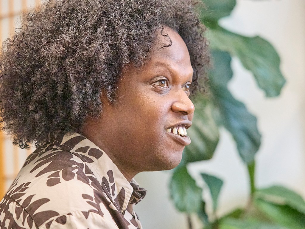 Camron Hurt, Common Cause Hawaii's new Program Director dominates the image as he discusses elements of a free society with Civil Beat's Editorial Board