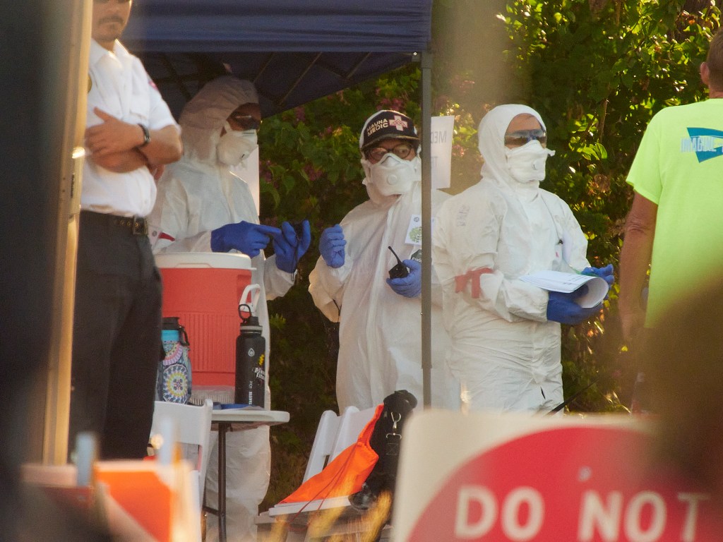Volunteers distributed re-entry kits for residents visiting the burn zone in September, including NIOSH-approved face masks, gloves, goggles, disposable shoe covers and coveralls to help people protect themselves from hazardous debris. (David Croxford/Civil Beat/2023)