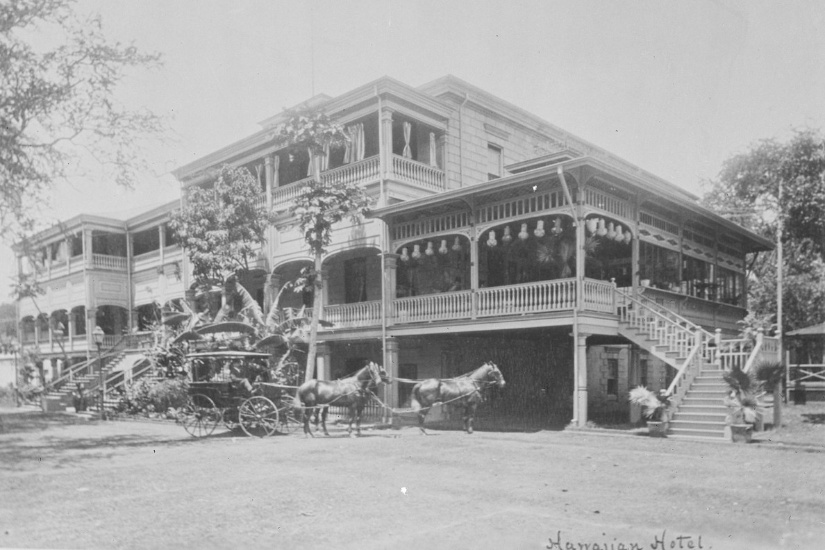 The front of the Royal Hawaiian Hotel showing a horse & buggy about 1880