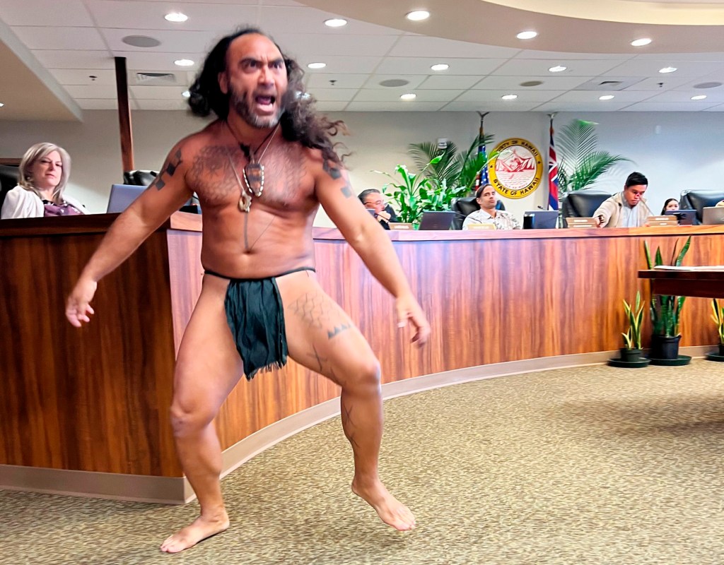 Big Island cultural practitioner Jonah Maikahaku I performs Hakakoa Warrior Lua dancer before the Windward Planning Commission. (Paula Dobbyn/Civil Beat/2024)