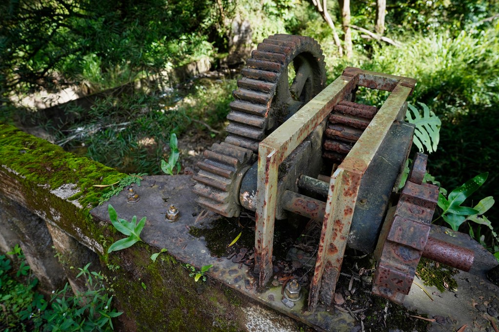 The mechanism to lower and raise a gate to divert water on Hoolawa Stream is photographed in its non-function state Thursday, Oct. 3, 2024, in Huelo. East Maui water rights are a point of contention. (Kevin Fujii/Civil Beat/2024)