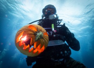 PHOTO ESSAY: What Lies Beneath? An Underwater Pumpkin Carving Contest