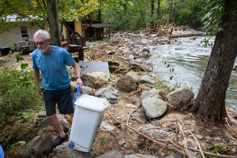 Flooding across North Carolina’s mountains left many residents with muddy, debris-strewn yards and flooded homes. (Melissa Sue Gerrits/Getty Images/The Conversation/2024)