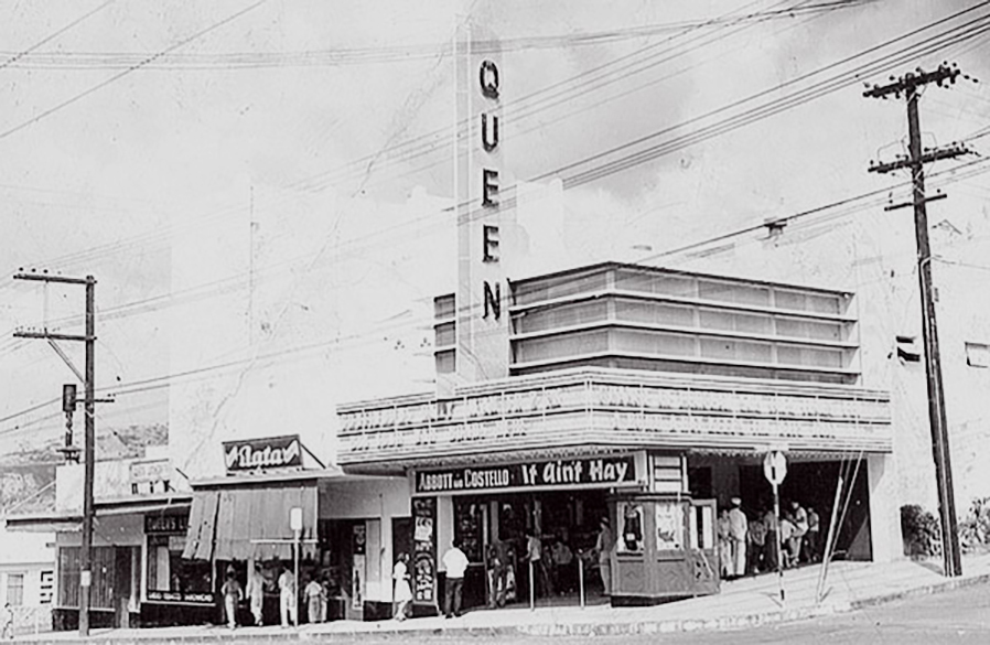 historical photo of Queens Theater with people queued to get in