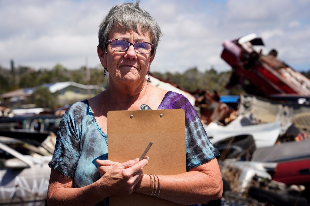 Heidi Jaworski has been keeping track of the abandoned vehicles and illegal dumping her Ocean View neighborhood Tuesday, April 1, 2025, on the Big Island. (Kevin Fujii/Civil Beat/2025)