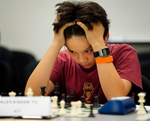 Photo Essay: National Chess Master Challenges Young Players