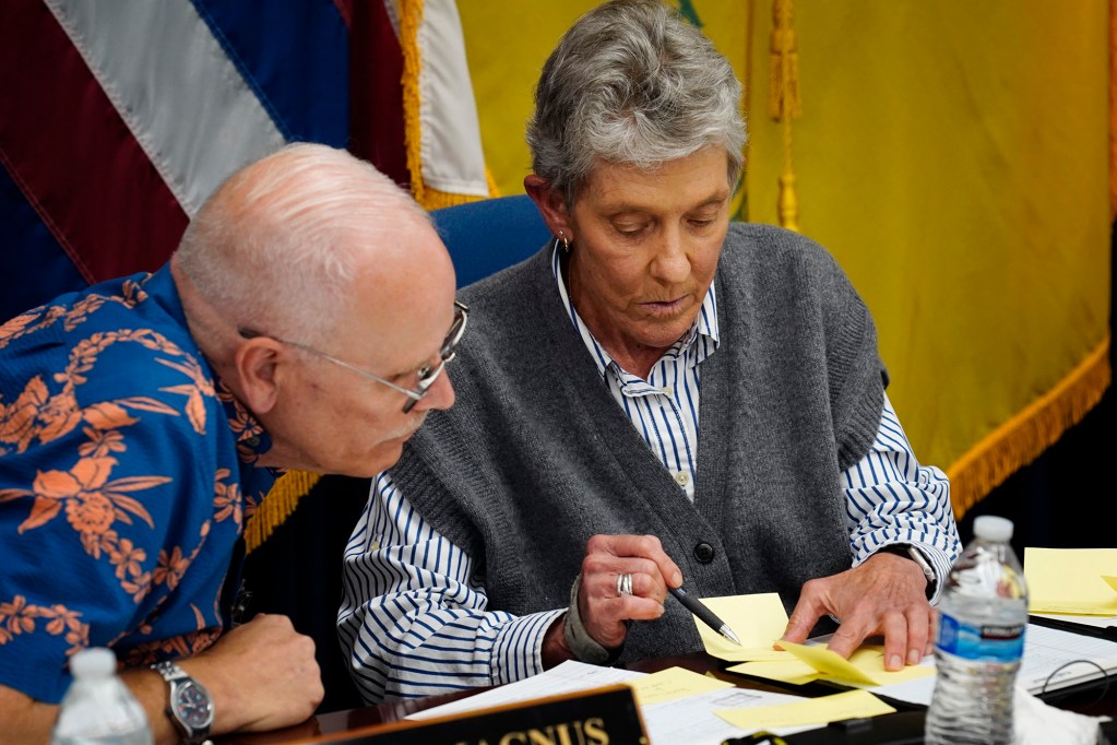 Honolulu Police Commission vice-chair Chris Magnus, left, confirms the votes for a new chief with chair Laurie Foster Wednesday, May 20, 2026, in Honolulu. David Lazar was selected with 5-2 beating out Mike Lambert. Scott Ebner received zero votes. (Kevin Fujii/Civil Beat/2026)
