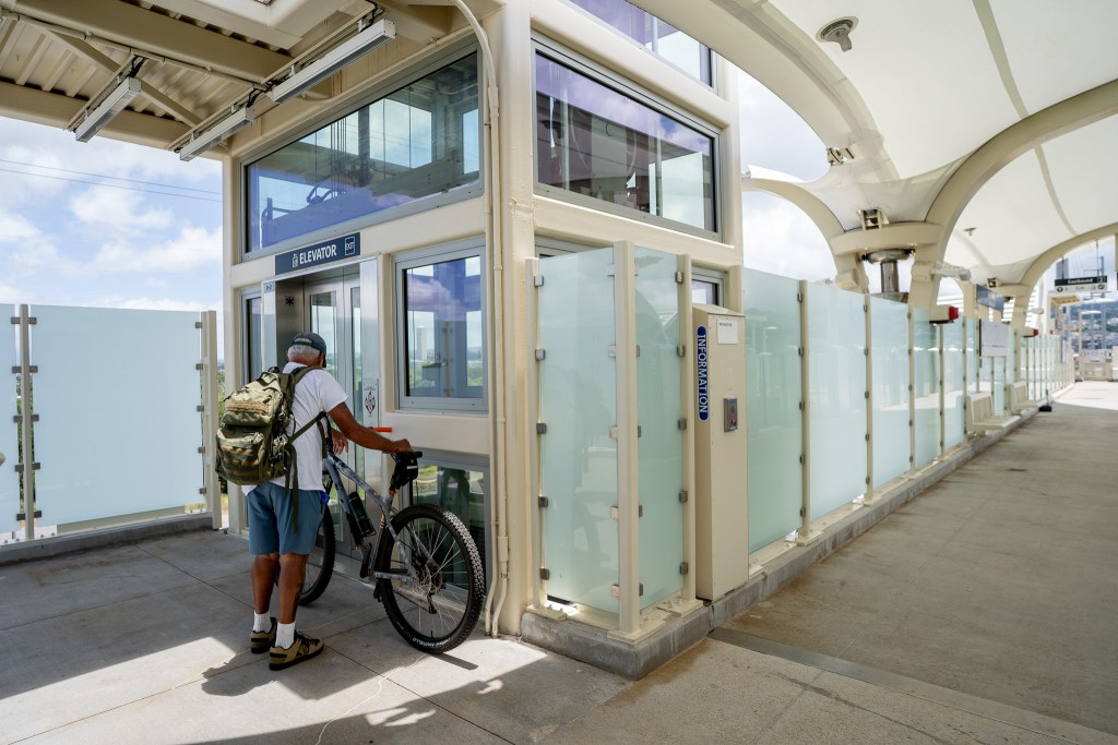 A man waits for an elevator at the Hālawa (Aloha Stadium) Skyline rail station June 25, 2026. (Craig Fujii/Civil Beat/2026)