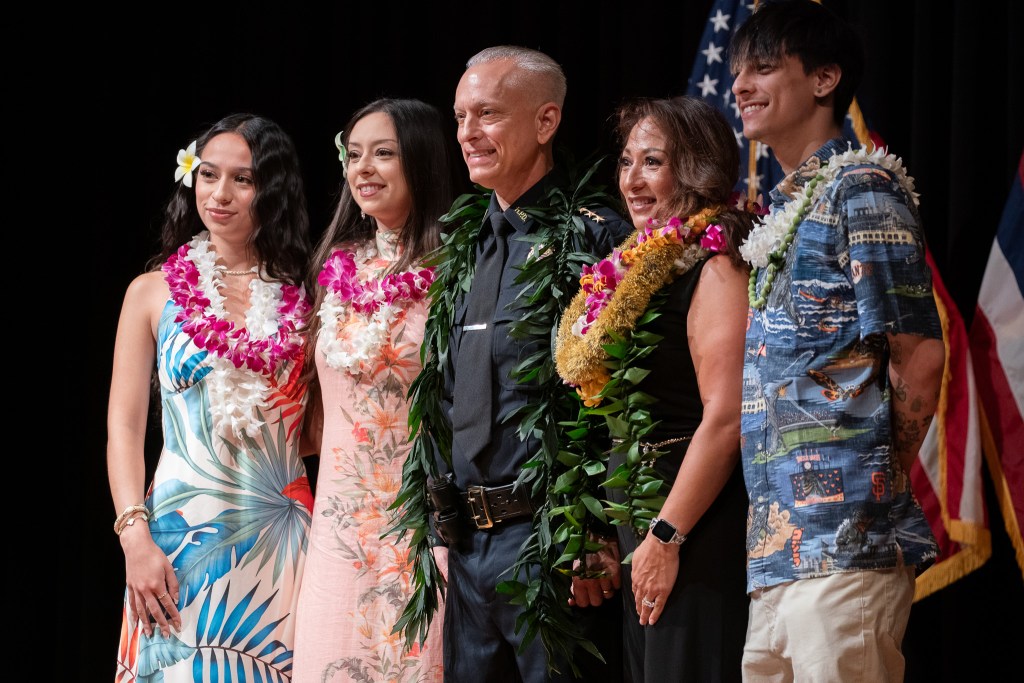 New HPD Chief David Lazar with his wife, Julie, a former detective, and their three children at his swearing in ceremony at Memorial Auditorium in Honolulu July 2, 2026. (Craig Fujii/Civil Beat/2026)